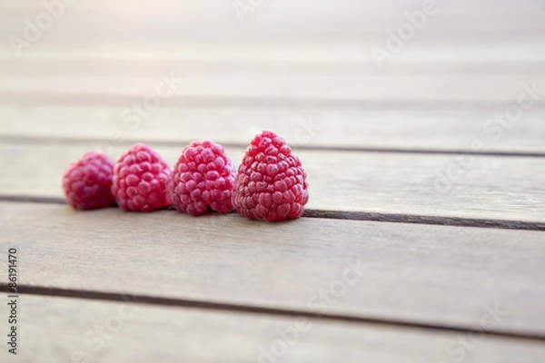 Fototapeta raspberries on wooden table