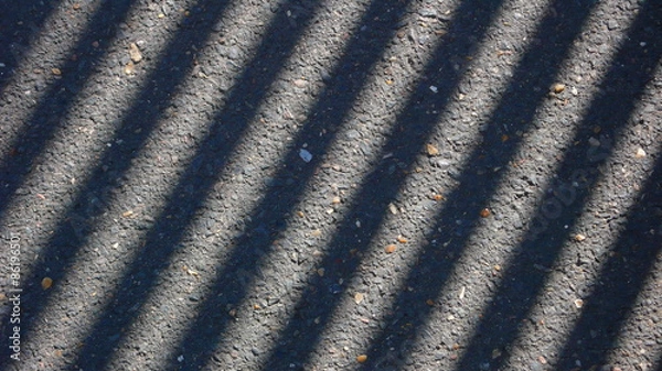 Fototapeta play of light and chadow on a pavement