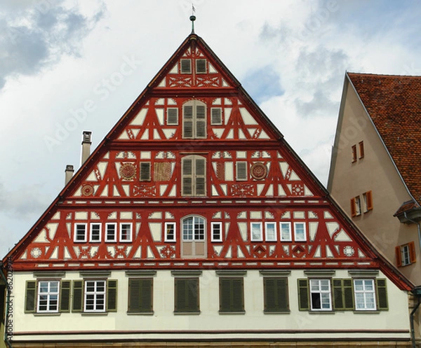 Fototapeta House with a red sun blind