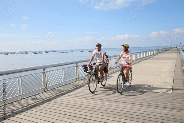 Obraz Family on a biking journey by the sea