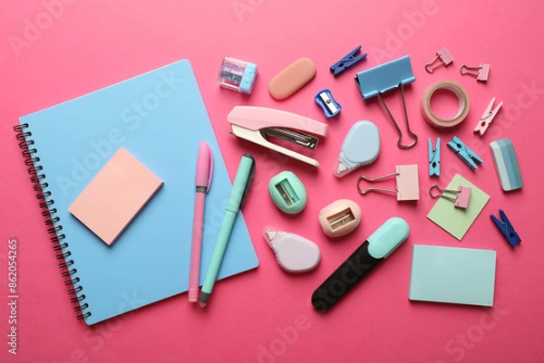 Obraz Flat lay composition with notebook, stapler and different stationery on pink background