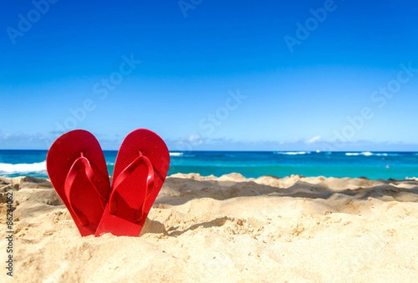 Obraz Red flip flops on the sandy beach