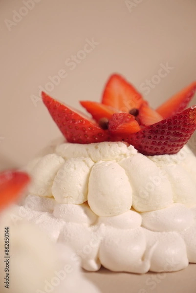 Obraz pavlova cake with soft white cream and strawberries. meringue cake. small pastry close up