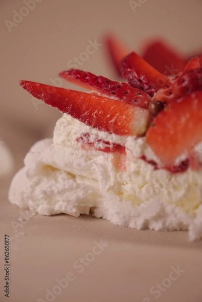 Obraz pavlova cake with soft white cream and strawberries. meringue cake. small pastry close up