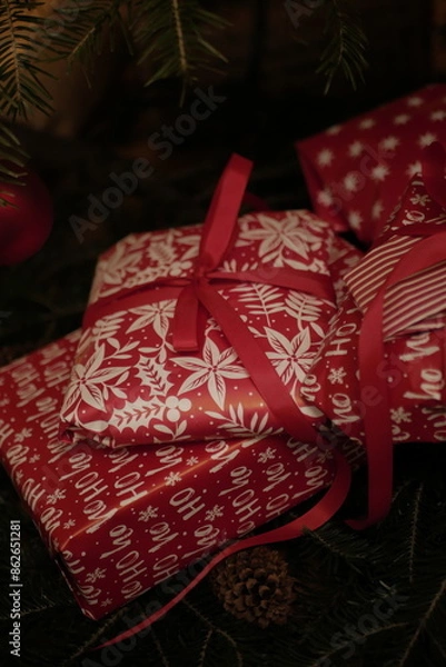 Obraz christmas and new year holidays. magical atmosphere. packaging and ribbons for gifts. beautiful boxes and things are packed under the Christmas tree.