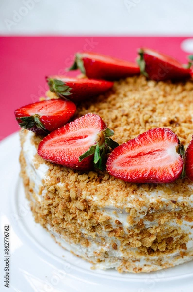 Fototapeta Crepe cake Medovik with sour cream vanilla cream and strawberries. Pancake cake Medovik decorated with strawberries.