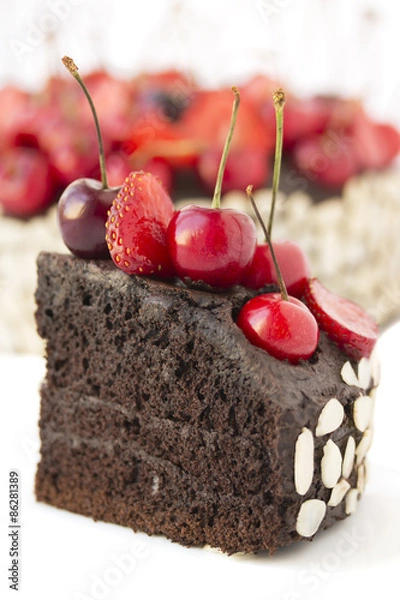 Fototapeta Chocolate cake with cherries.