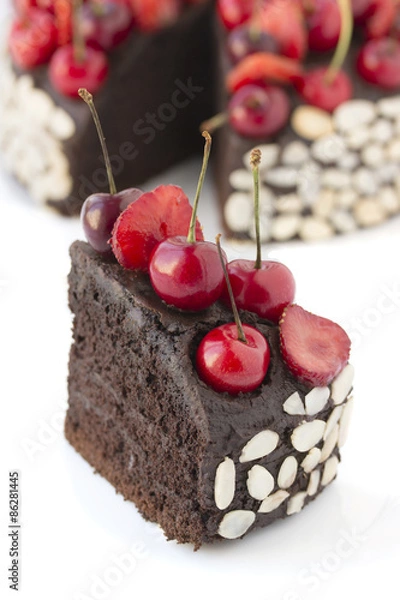 Fototapeta Chocolate cake with cherries.