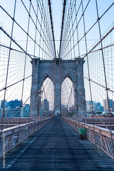Fototapeta new york city architecture. brooklyn bridge to manhattan. urban architecture landmark of brooklyn bridge. architecture of metropolis city. brooklyn bridge. Architectural marvel