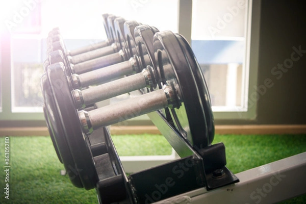 Fototapeta dumbbell in gym - vintage effect and sun flare filter effect