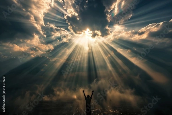 Obraz A person is standing in the clouds, with the sun shining down on them. Concept of hope and positivity, as the person appears to be reaching for the sun