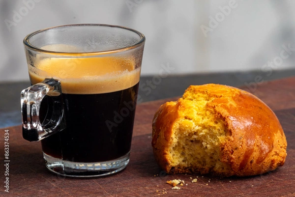 Fototapeta Espresso with cornbread on rustic cutting board