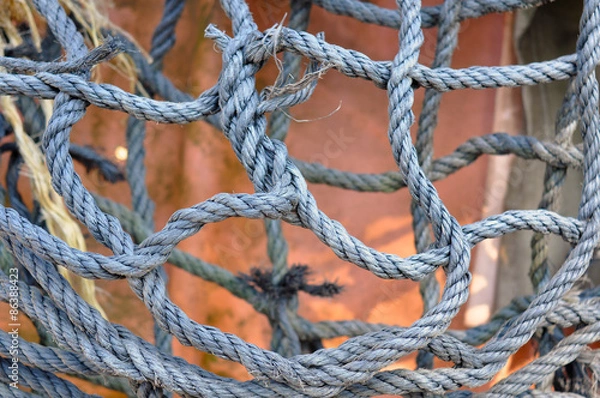 Fototapeta Rope net. Weave texture. Large knot made of rope