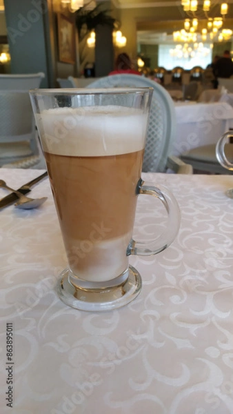 Fototapeta cup of coffee on table in cafe