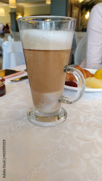 Fototapeta cup of coffee on table in cafe