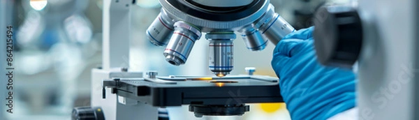 Fototapeta Discover hidden worlds through microscope exploration with a focused scientist.