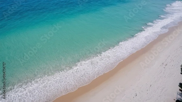 Fototapeta a photograph of an aerial view of a sandy beach with a blue ocean and a white sand beach
