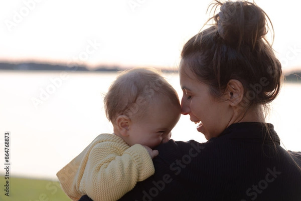 Fototapeta Mother and young daughter smiling - close up on faces 