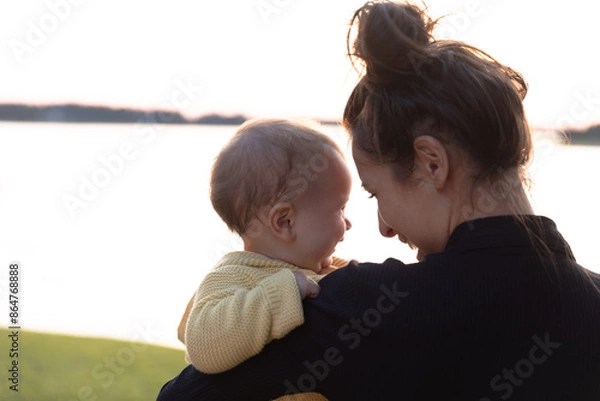 Fototapeta Mother and young daughter smiling and laughing- close up on faces 