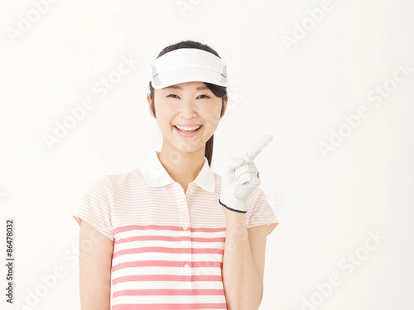 Obraz ゴルフウェアを着て指差す女性