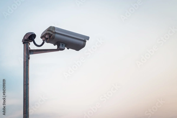 Obraz Security camera on blue sky background