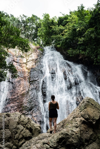 Obraz Stunning view of a girl in front of Na Muang Waterfall, Koh Samui, Thailand.