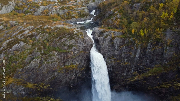 Obraz Breathtaking aerial view on the huge waterfall and the valley around it. Bird eye view and rainbow next to the waterfall. Norway, Manafossen.
