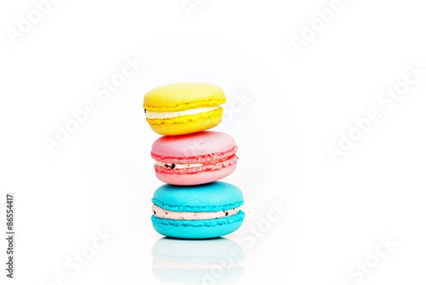 Obraz Stacked pastel color macaroons on white background with selectiv