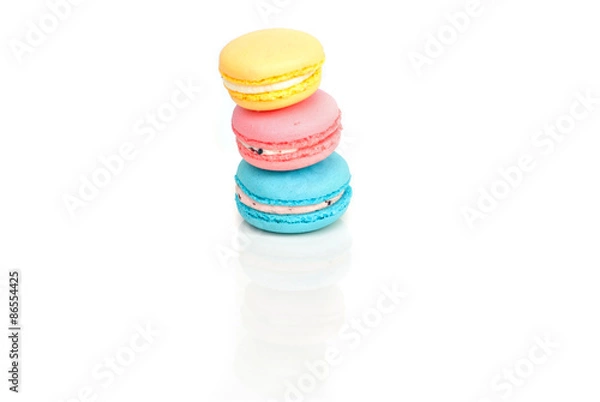 Obraz Stacked pastel color macaroons on white background with selectiv