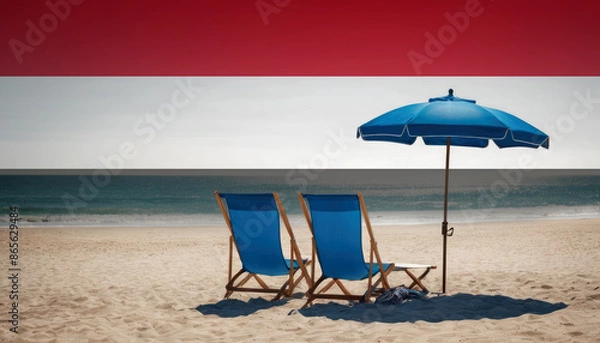 Fototapeta Two blue beach chairs and an umbrella await, inviting travelers to experience a relaxing Yemen beach vacation