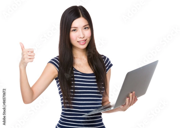 Fototapeta Woman use of the laptop computer and thumb up