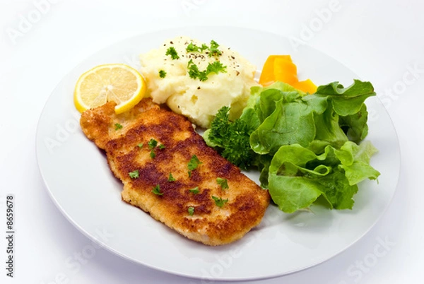 Obraz schnitzel -paniert mit salat