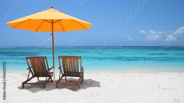 Fototapeta Beach chairs and an umbrella on a white sand beach Light bright background