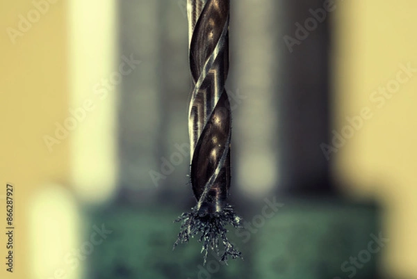 Obraz Industrial machinery. Detail of a drill bit with metal shavings sticking.