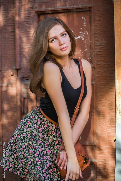 Fototapeta Girl with red lips in blue wearing
