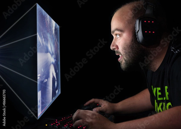 Obraz Gamer playing a first person shooter on high end pc.
