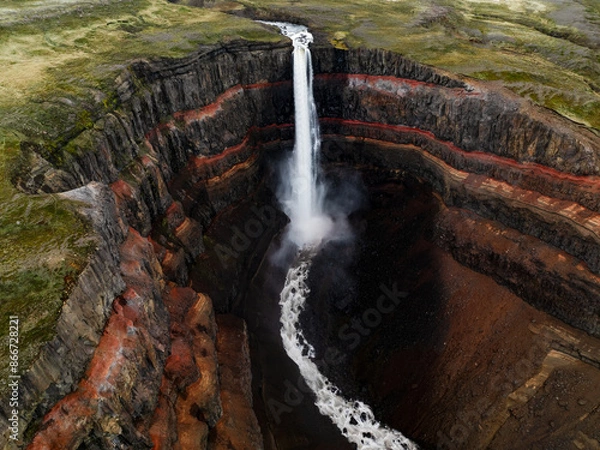 Obraz View from above, stunning aerial view of the Hengifoss Waterfall. Hengifoss, is eye-catching due to the striking red clay and black basalt patterns of the cliff face. Fljótsdalshreppur, East Iceland.
