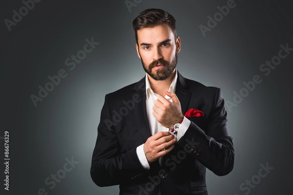 Obraz Man's style. Elegant young man getting ready. Dressing suit, shirt and cuffs
