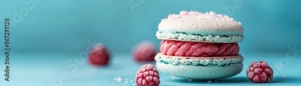 Obraz Delicious Blue and Pink Macaron with Fresh Raspberries on a Blue Background