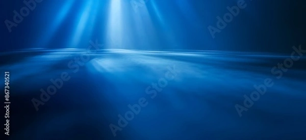 Fototapeta A beautiful blue background with smooth light beams.

