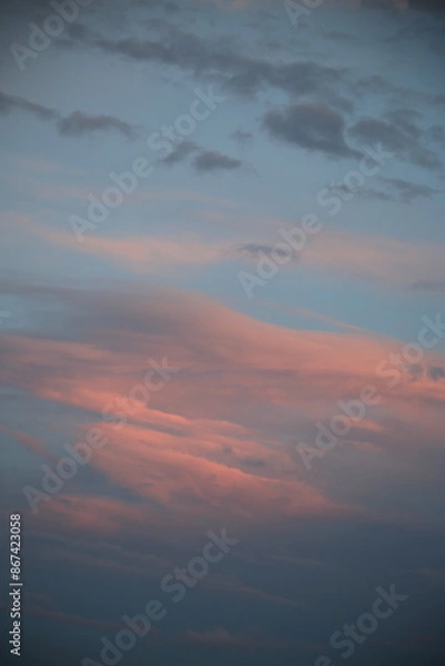 Obraz beautiful cloudy sunset creating pink and orange clouds.