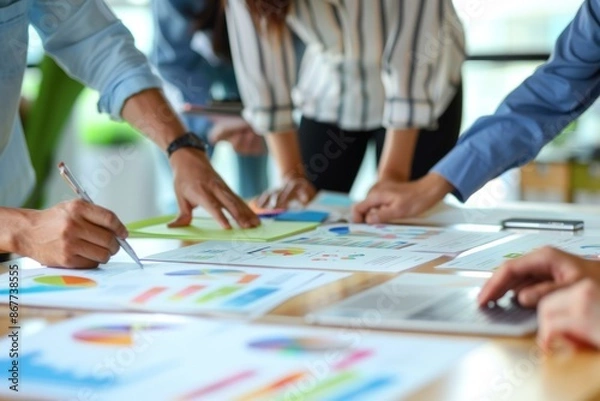 Fototapeta Close-up of American hands preparing meeting materials, organized and detailed, bright office setting