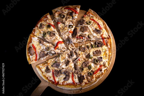 Obraz Close-up of a hand taking a slice of vegetarian pizza with onions, bell pepper, and vegetables on a wooden board.
