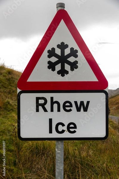 Fototapeta Snowflake ice triangular warning sign, bilingual Rhew, Wales, Un