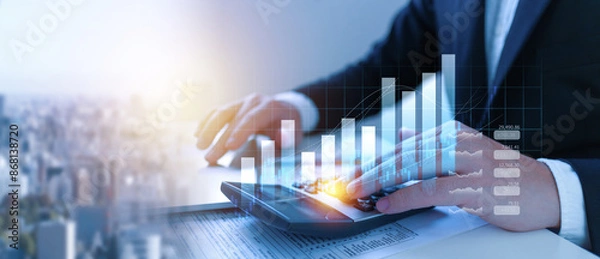 Obraz Businessman using the laptop computer and calculator tax online return form for payment, Accounting financial research, government taxes and calculation tax return concept.