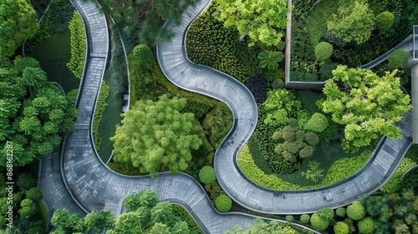 Obraz Wine grapes hang from a vine next to a weathered wine barrel, creating a peaceful scene amidst the garden's trees and plants