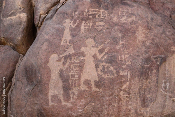 Fototapeta Ancient egyptian carvings and hieroglyphs carved on Famine Stela stones in Aswan, Egypt 