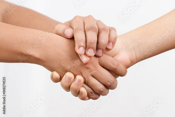 Fototapeta Concept of holding hands to encourage