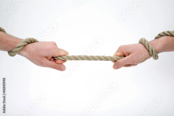 Obraz  Two hands holding and pulling the rope 