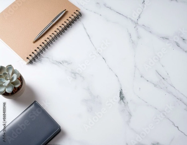 Fototapeta 大理石デスクに置かれたノートや植物